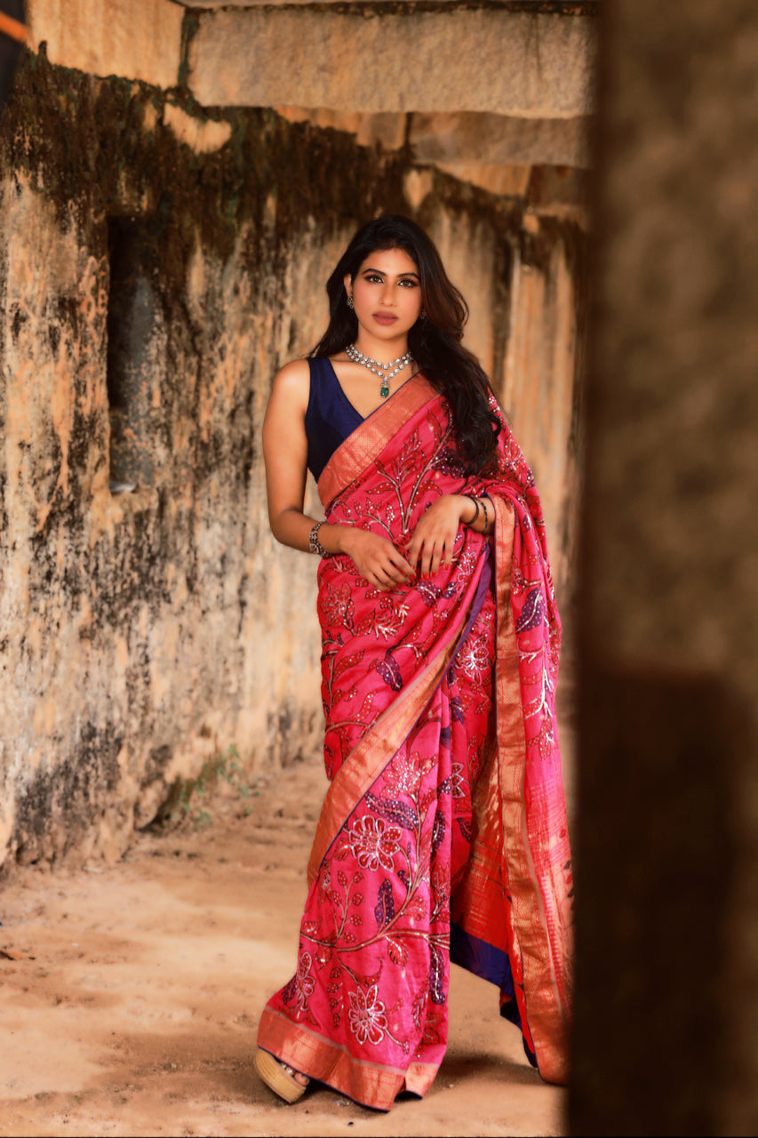 Hot Pink Paithani Silk Saree with Kalamkari and Sequin Embroidery, showcasing vibrant elegance and artistic intricacy. The saree features a hot pink silk base with beautiful Kalamkari motifs and shimmering sequin embroidery.