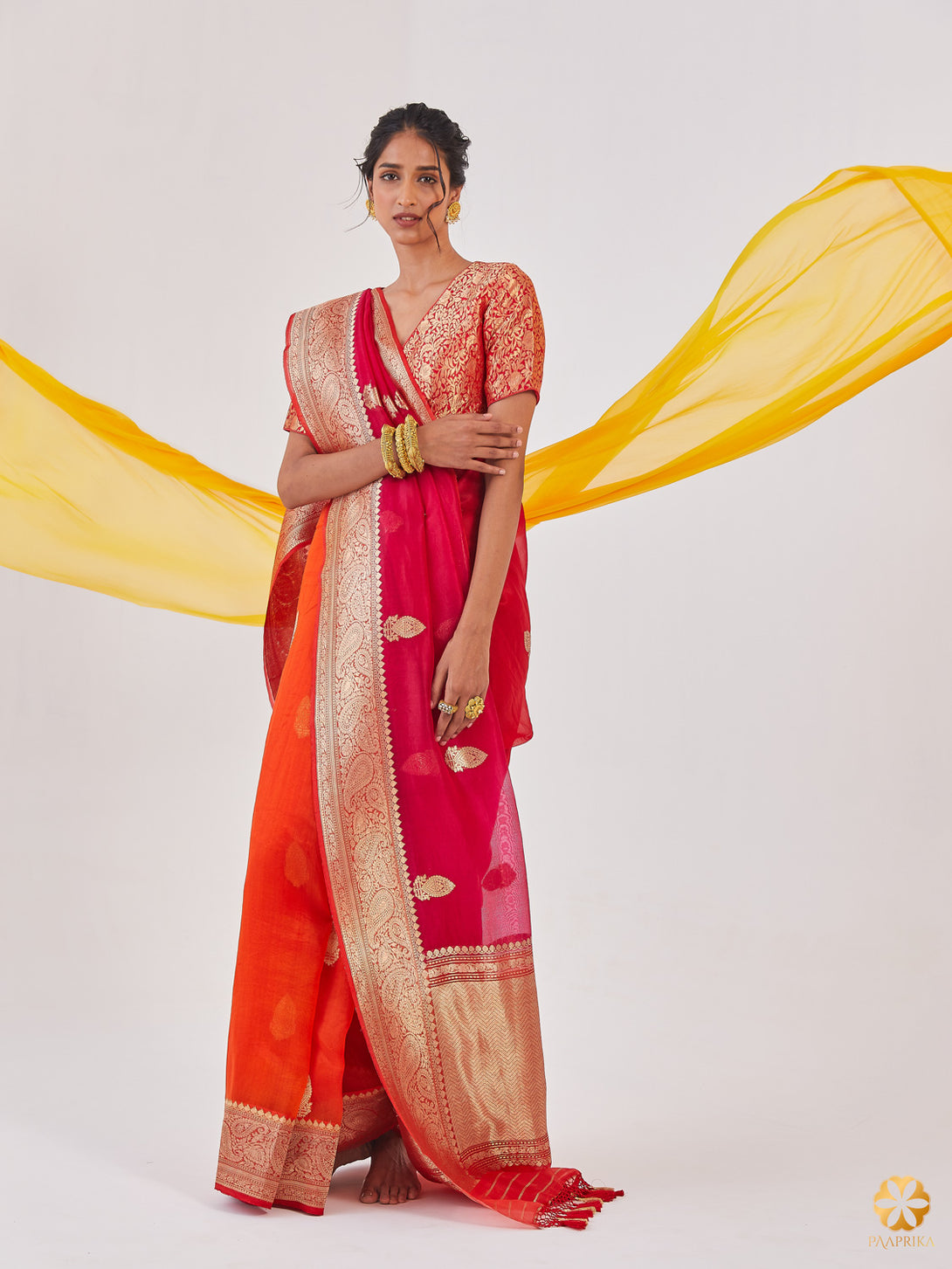 A Stylish Woman Wearing Mesmerizing Orange to Red Banarasi Ombre Organza Saree - Effortless Grace.