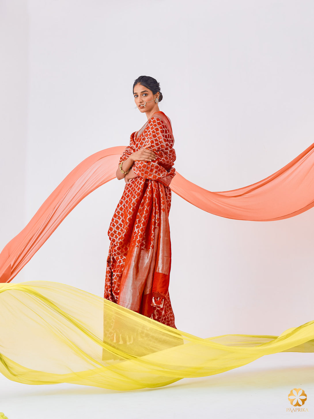 A Stylish Woman Wearing Fashionable Red Silk Saree with Jaal Design - Effortless Grace and Contemporary Charm.