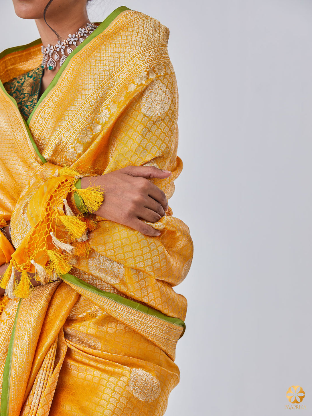 Close-up of Intricately Woven Butis and Parrot Green Selvedge Detailing - Sandal Yellow Banarasi Saree.
