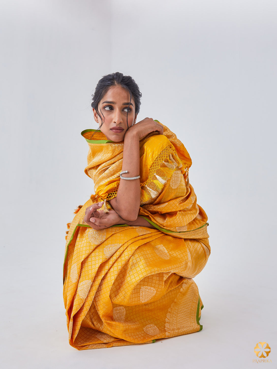 Stylish Woman Wearing Timeless Sandal Yellow Banarasi Saree - Effortless Elegance and Sophistication.  Image 5: Alt text: Perfect for Weddings, Festive Celebrations, and Special Occasions - Embrace the Beauty and Charm of this Exquisite Ensemble.