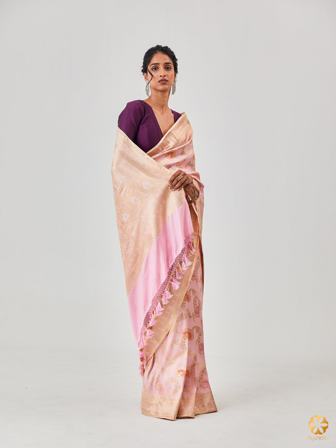 A Stylish Woman Wearing Enchanting Pastel Rose Banarasi Saree with Color Popping Minakari - Effortless Beauty and Opulence.