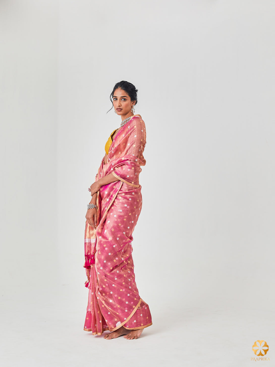 Beautiful Drape of Luxurious Blush Pink Handwoven Tissue Saree - Elegance Personified.