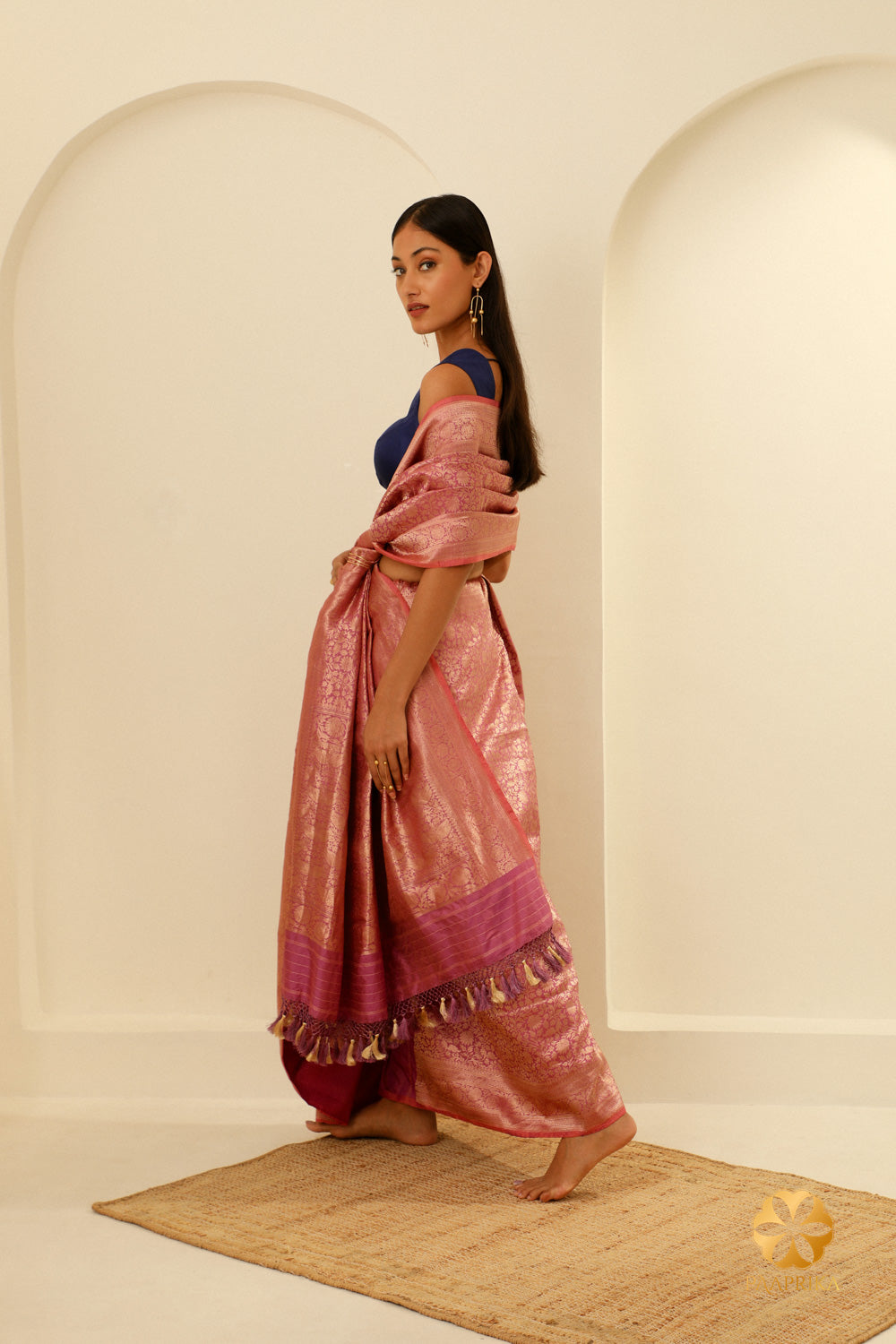 The saree elegantly draped capturing its timeless elegance and the allure of Banarasi brocade.