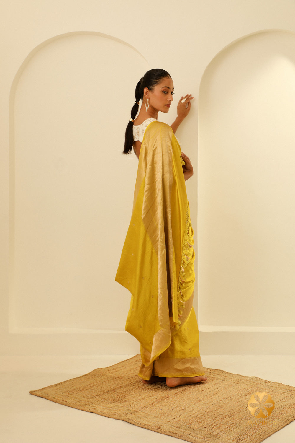 The premium Mashru silk fabric, used to craft the saree, emphasizing its visual appeal and comfort.