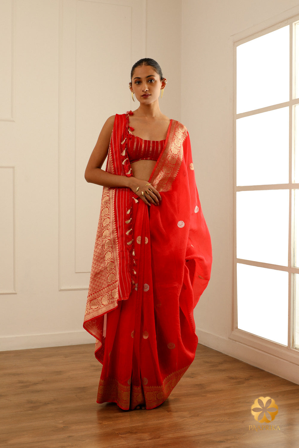  A styled look featuring the saree, perfect for weddings, grand celebrations, or special events.