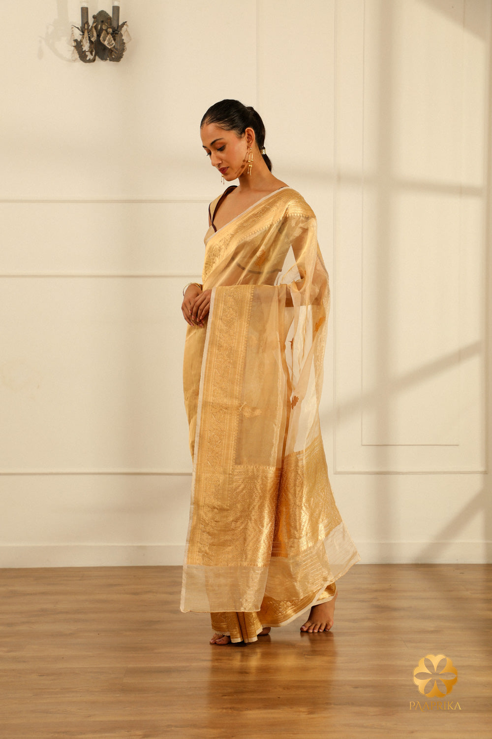 Close-up of Traditional Elegance in Golden Banarasi Saree.
