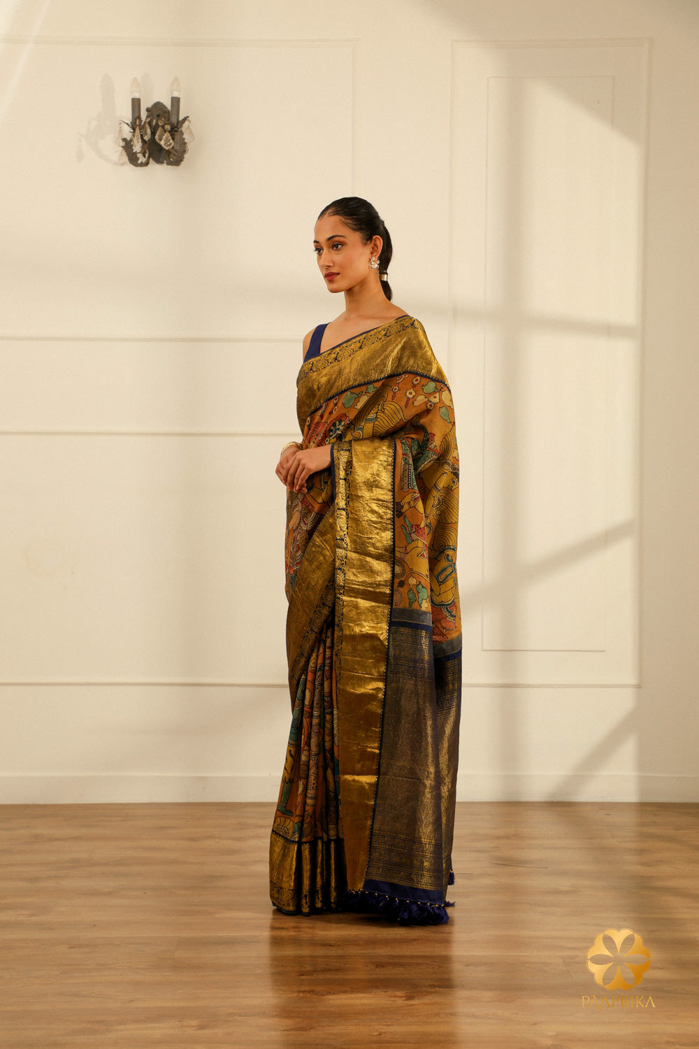 A full-length shot of a woman gracefully draped in the Kanjivaram saree, radiating cultural richness and spiritual significance.