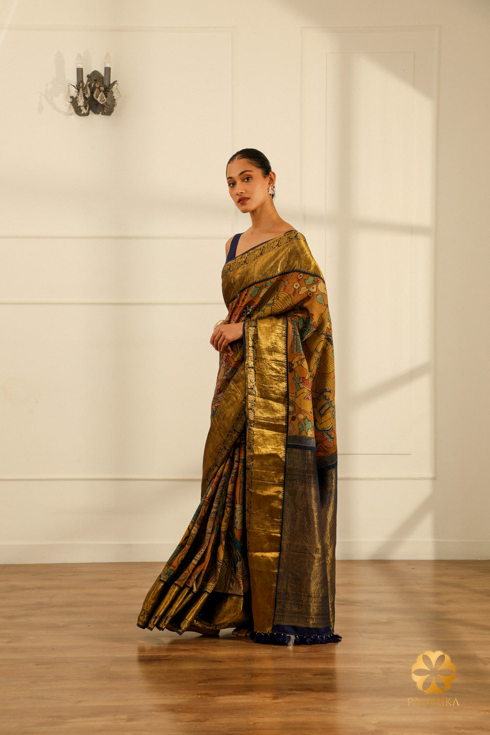 A broader view of the entire Kanjivaram saree, displaying the captivating Kalamkari design and the rich texture of the silk.