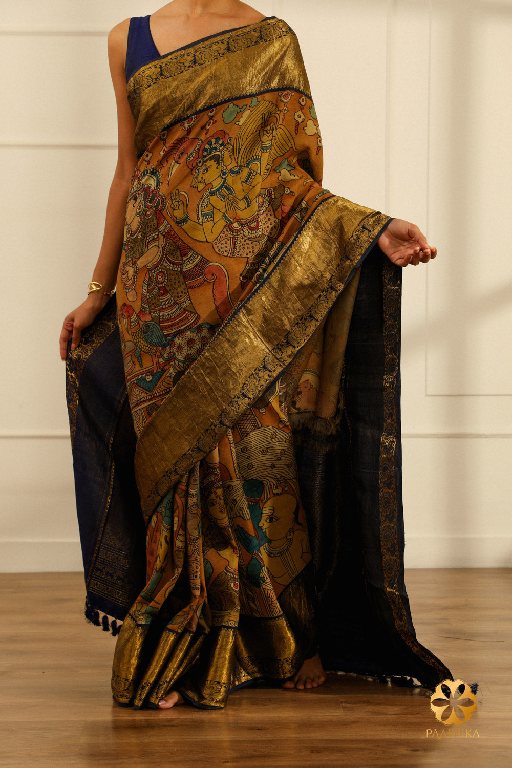  A close-up of the saree's border, showcasing the woven peacocks in a rich navy blue color, adding elegance and symbolism.
