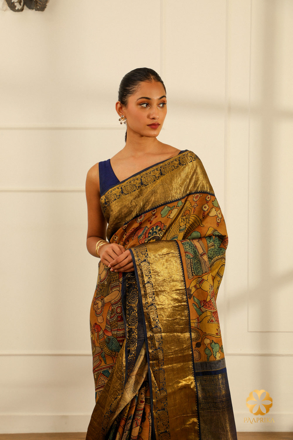 A broader view of the entire Kanjivaram saree, displaying the captivating Kalamkari design and the rich texture of the silk.