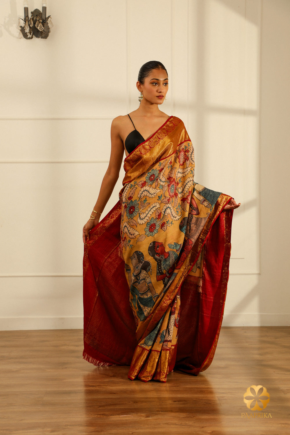 A full-length shot of a woman gracefully draped in the Kanjivaram saree, radiating elegance and charm.