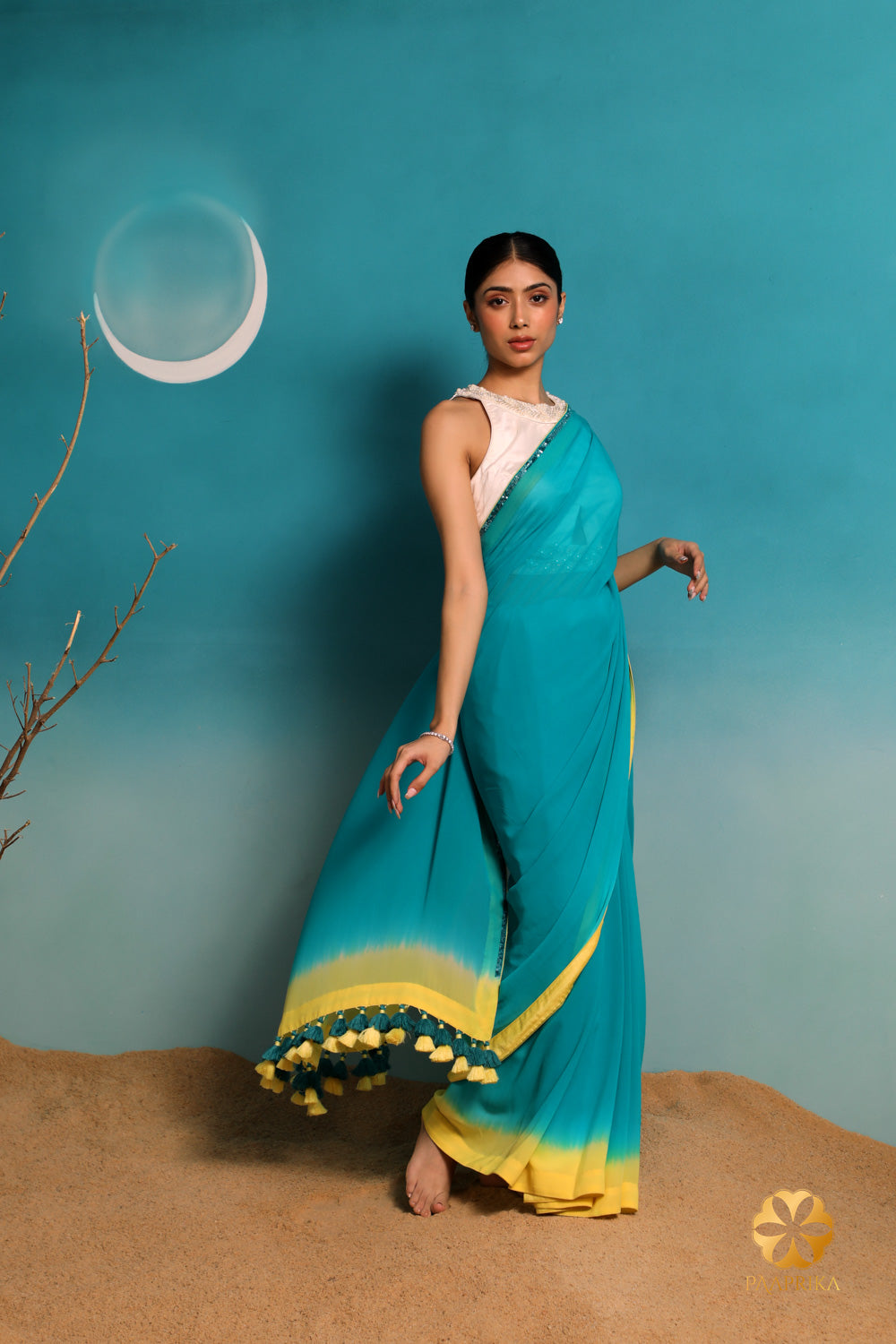 Exquisite Teal Georgette Saree with Pastel Yellow Ombre Border and Hand-Embroidered Sequins, Adorned with Teal and Yellow Tassels