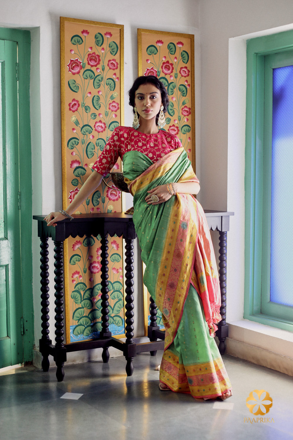 Mint green handwoven spunsilk saree with intricate multicolor detailing, a fusion of elegance and vibrant craftsmanship