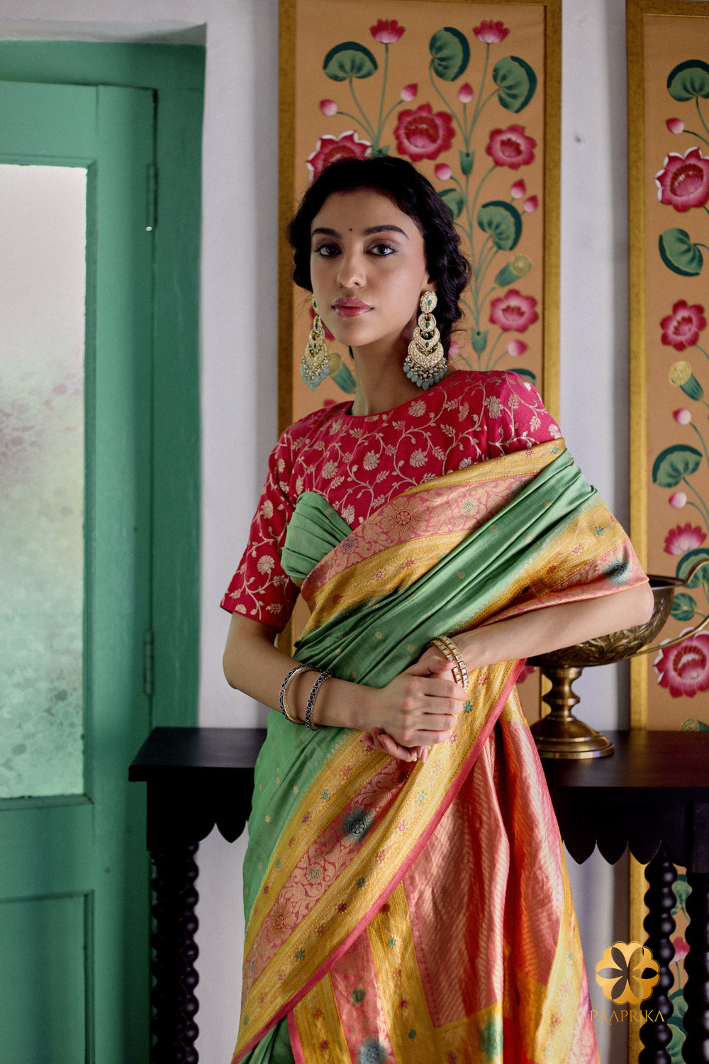 Elegant mint green handwoven spunsilk saree showcasing beautiful multicolor patterns, a symbol of timeless beauty