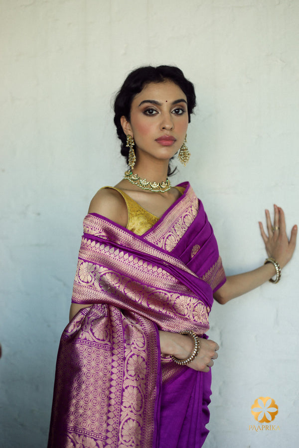 Elegant violet pure silk saree adorned with intricately woven chand buta pattern for a timeless and luxurious look.