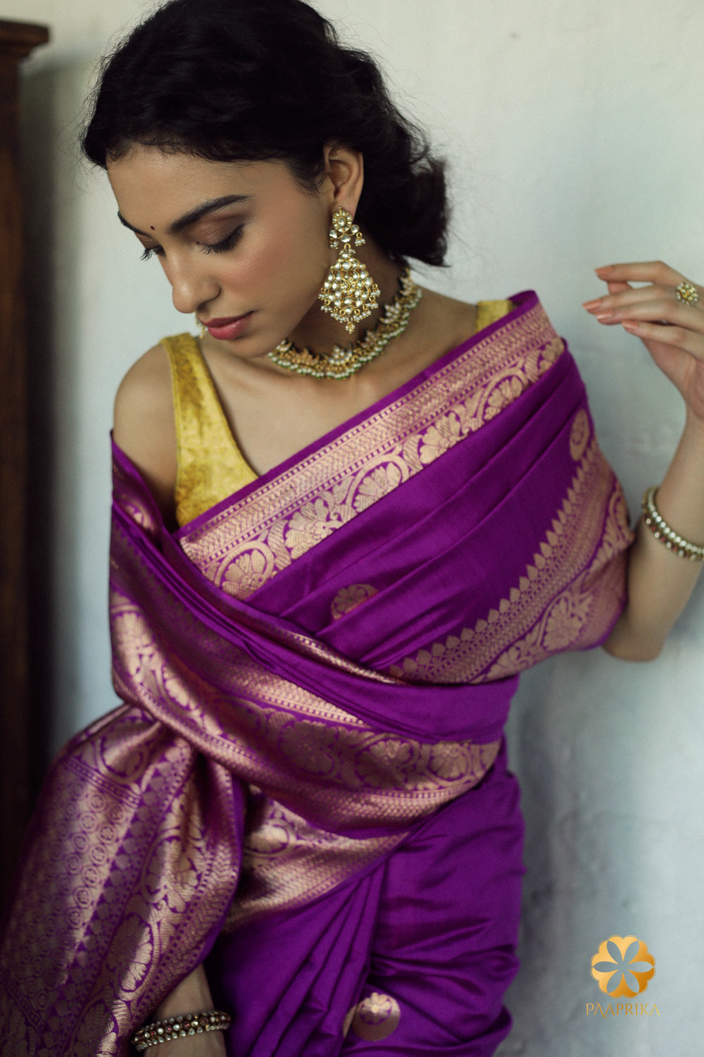Captivating violet pure silk saree featuring artful chand buta weaving, a stunning choice for any festive celebration