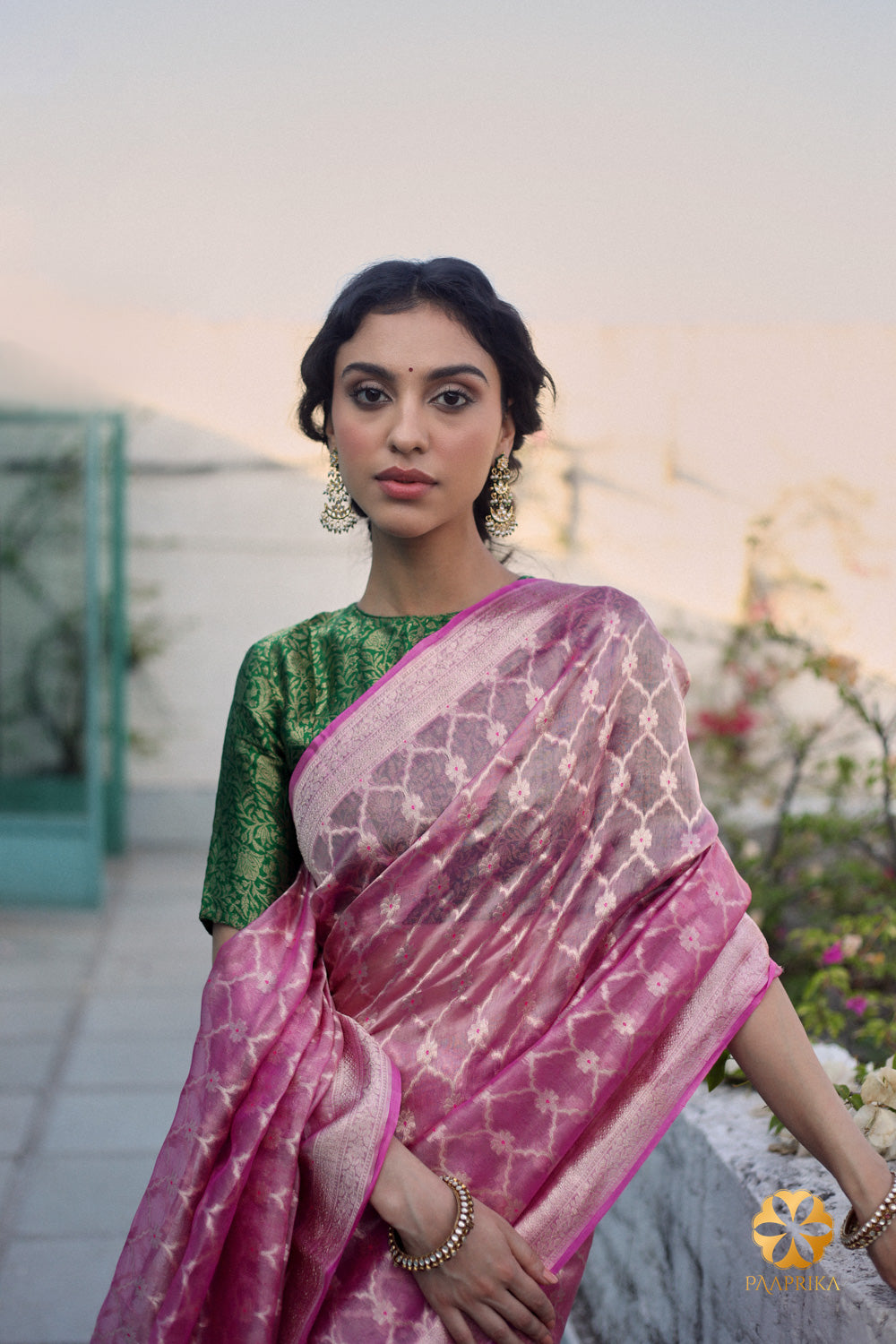 Graceful pink saree with intricate tissue detailing in an enchanting Moroccan pattern, a celebration of elegance and artistry.