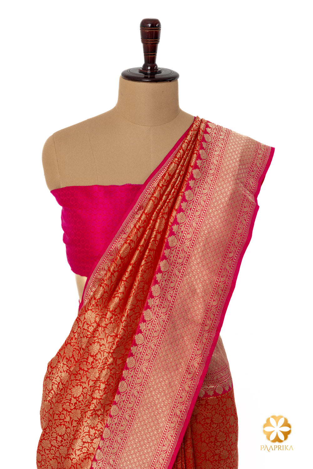 The saree draped gracefully on a mannequin.
