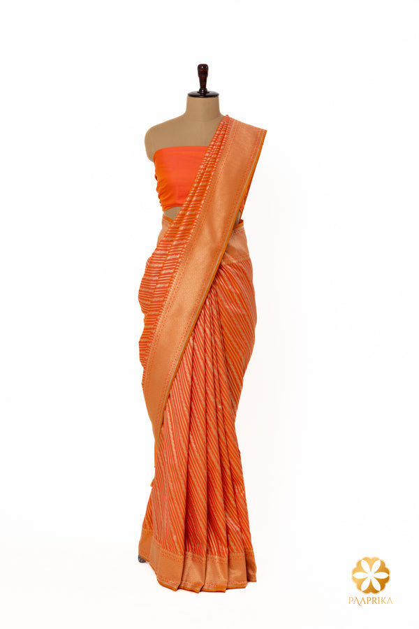 Stripes add a unique and eye-catching element to the saree.