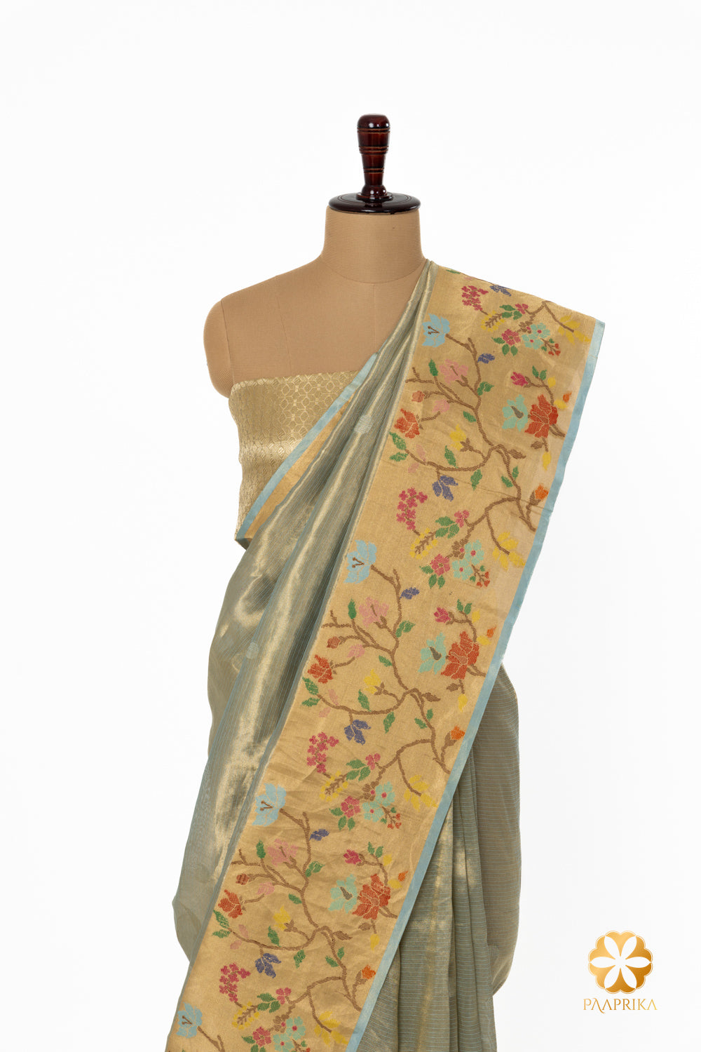 The entire saree elegantly displayed, showcasing its opulent design.