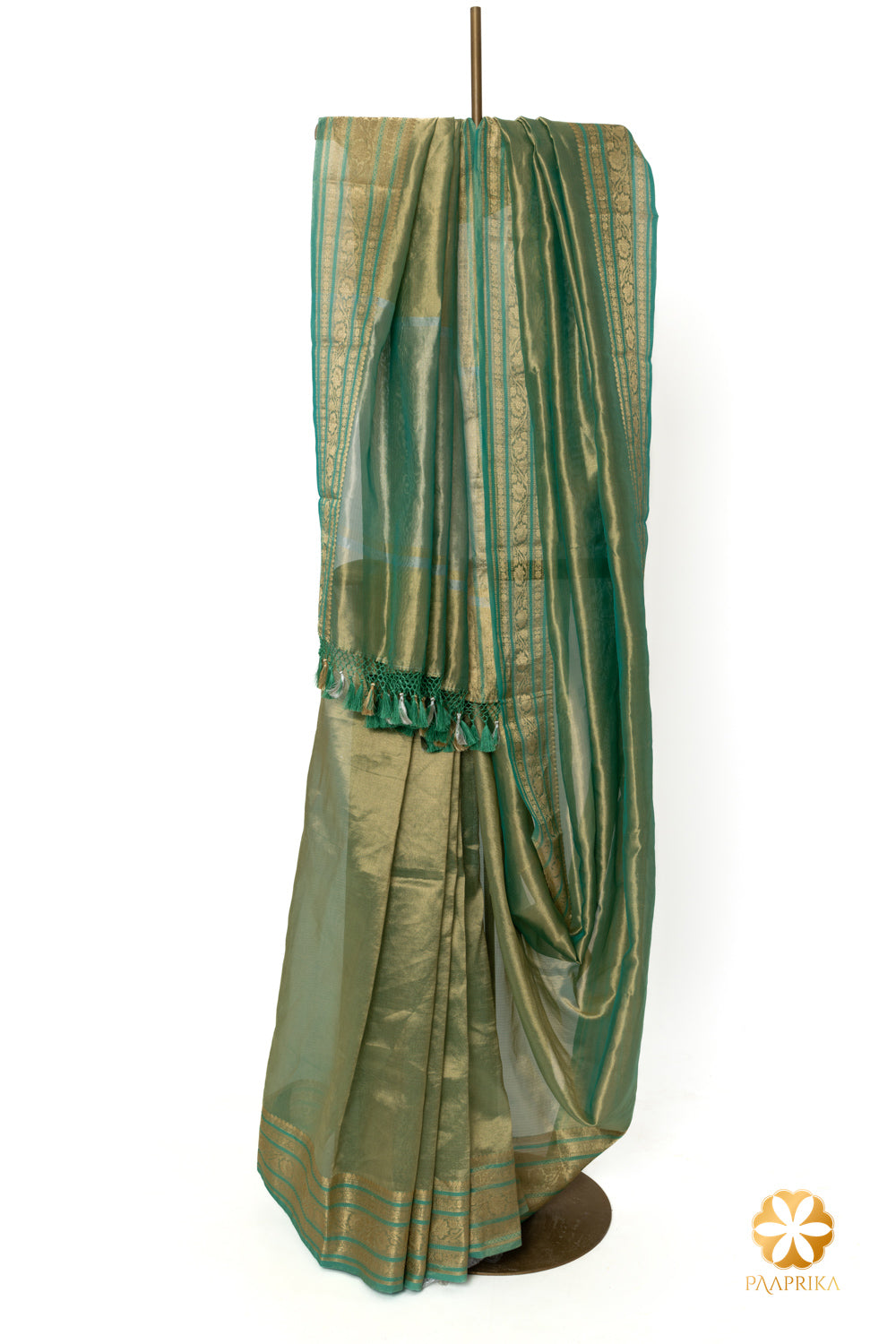 Close-up of the opulent golden woven temple border on the turquoise blue saree.