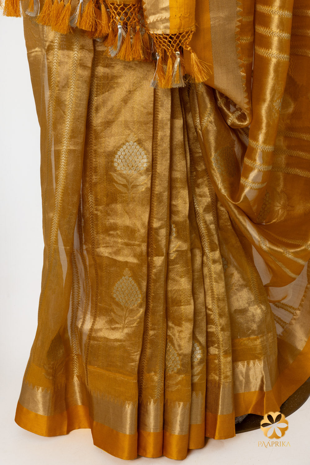 Luxurious golden tissue fabric of the saree, ensuring comfort and style.