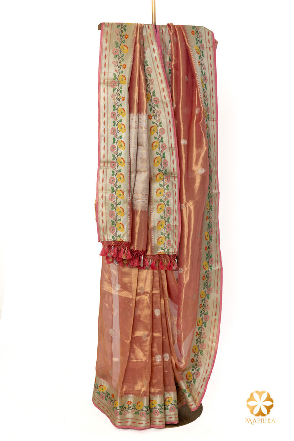 Contemporary Coral Pink Handwoven Tissue Saree with Multicolor Floral Border Accents