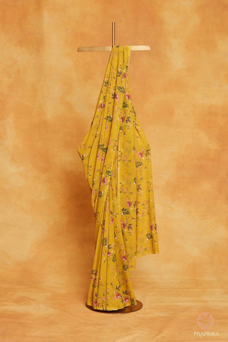 Radiant Yellow Floral Printed Georgette Saree, a vibrant and graceful choice to embrace the sunshine with its charming florals.
