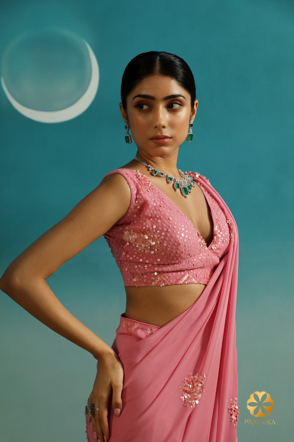 Handcrafted pastel rose georgette saree with a stunning embroidered blouse. Elevate your style for memorable occasions.