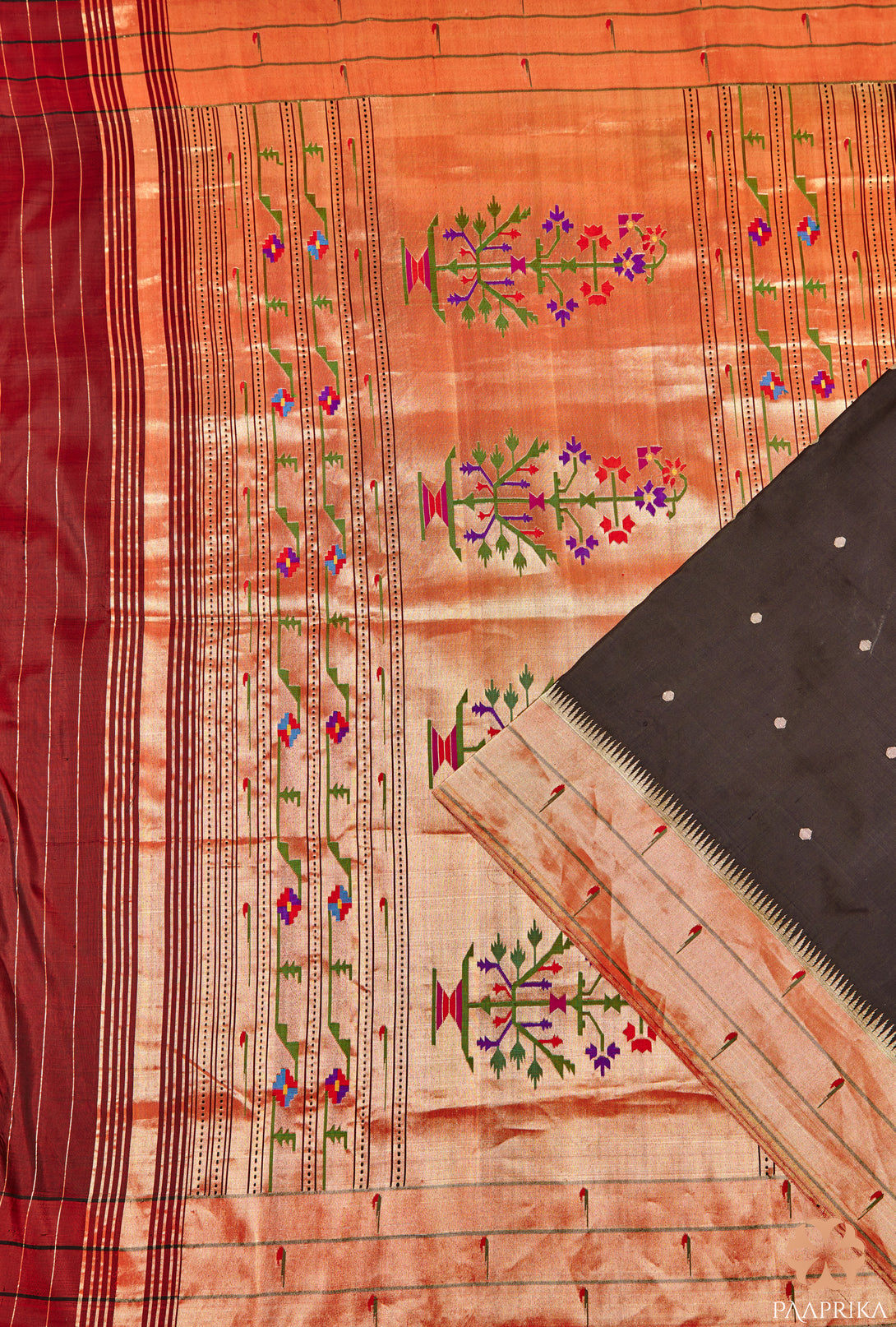Close-up of the intricate Muniya motifs on the Stunning Black Triple Muniya Handwoven Paithani Silk Saree. The detailed handwoven designs in vibrant colors add a touch of elegance and cultural heritage to the black silk fabric, showcasing the artistic mastery of Paithani silk sarees.